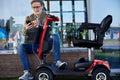 Metro Mobility 4-Wheel Mobility Scooter, Pneumatic Tires, Easy Charge and Automatic Braking System - Red (FREE Seat Cushion with Strap)